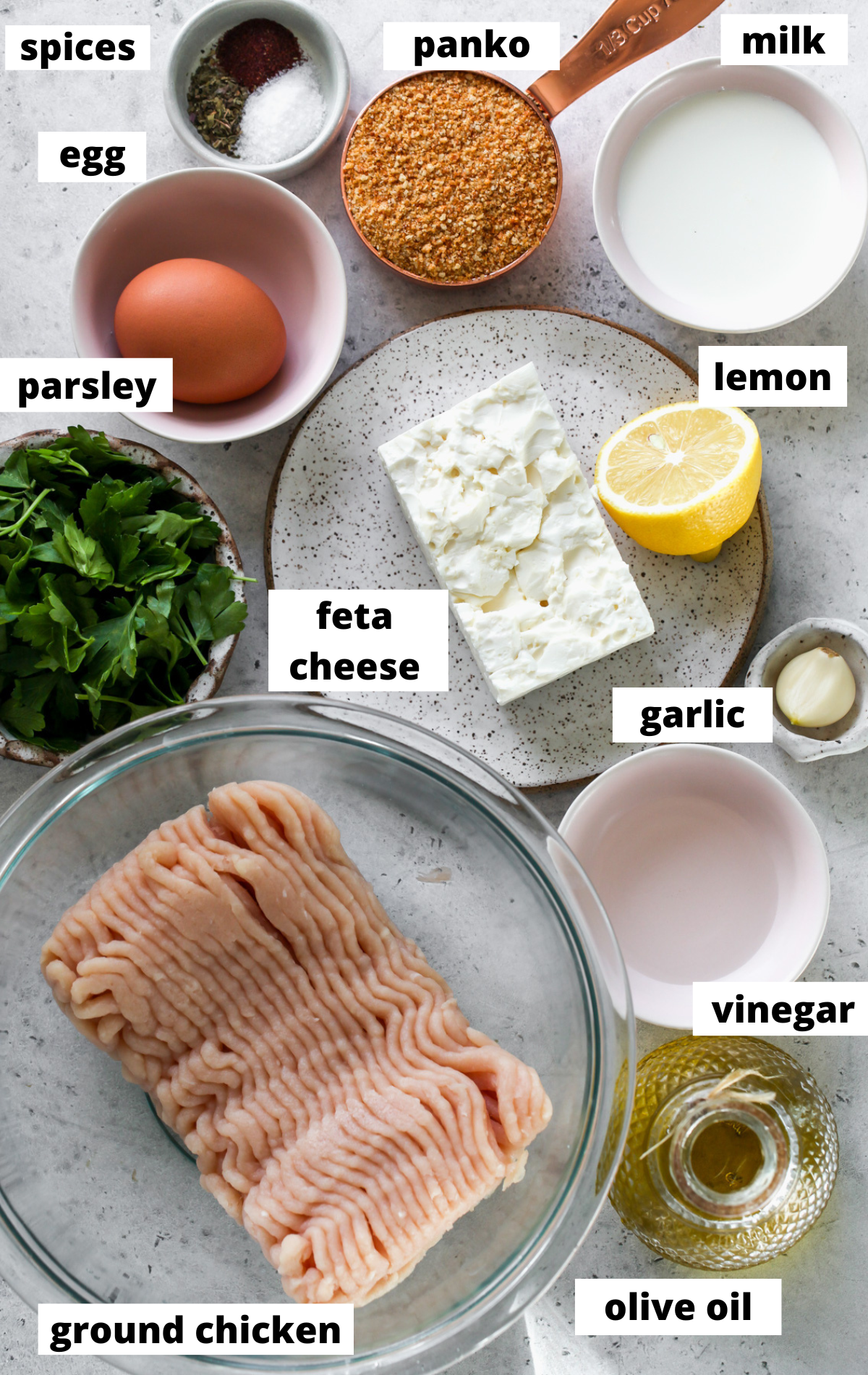 Recipe ingredients in separate bowls arranged on a blue surface.
