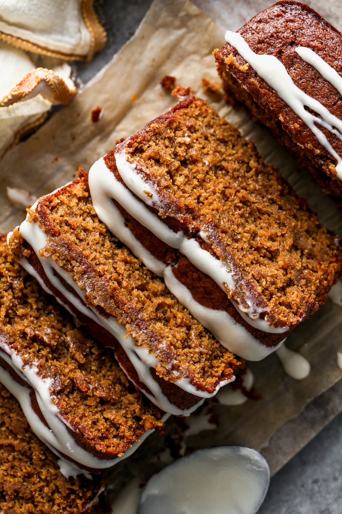 Gingerbread banana bread sliced on a cutting board.