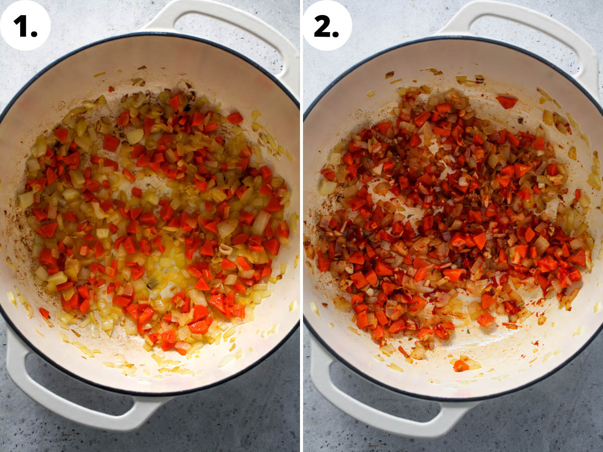 Onion, carrots, tomato paste, garlic, and spices simmering in olive oil in a large white pot.