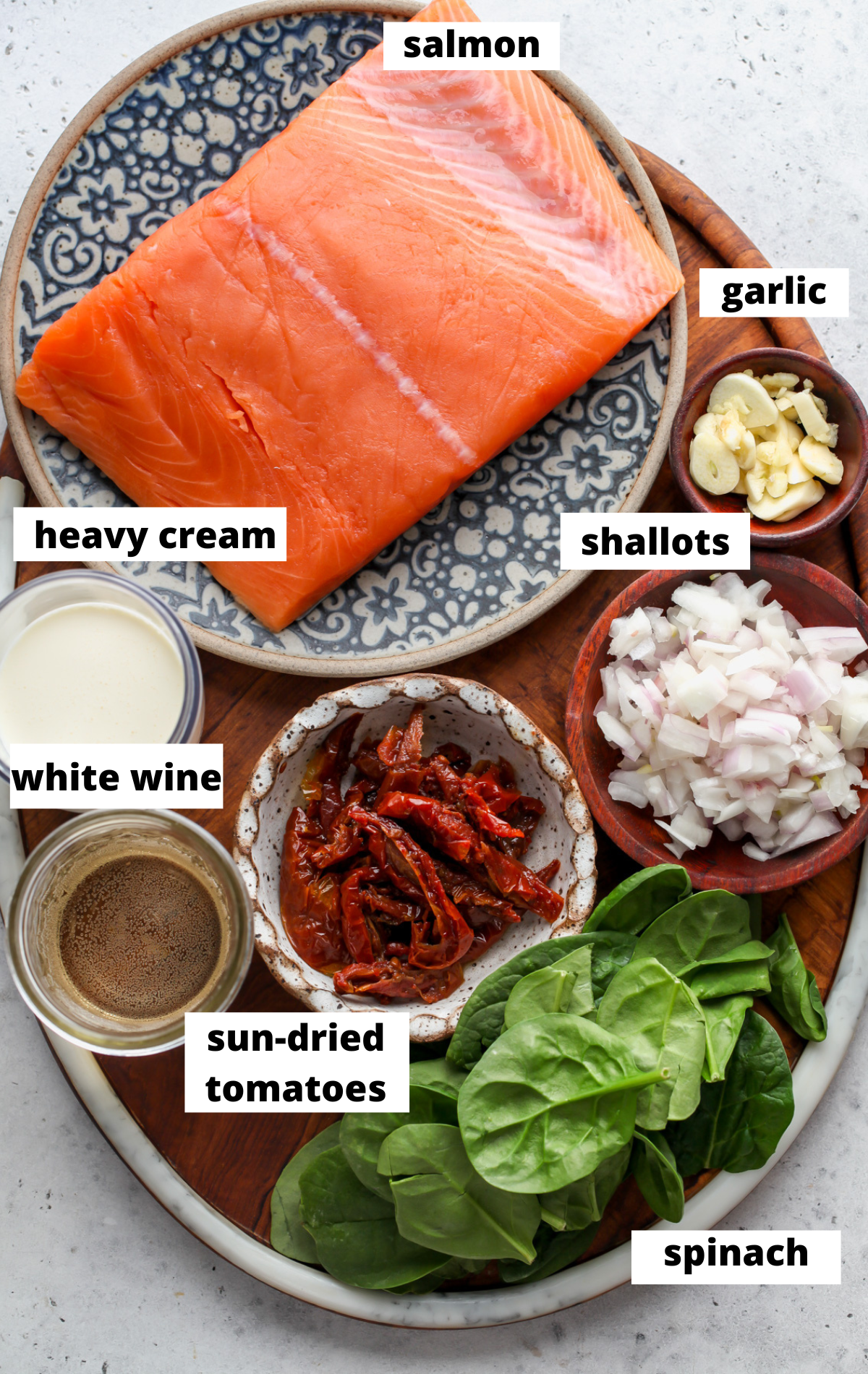 Recipe ingredients arranged on a wooden board with labels.