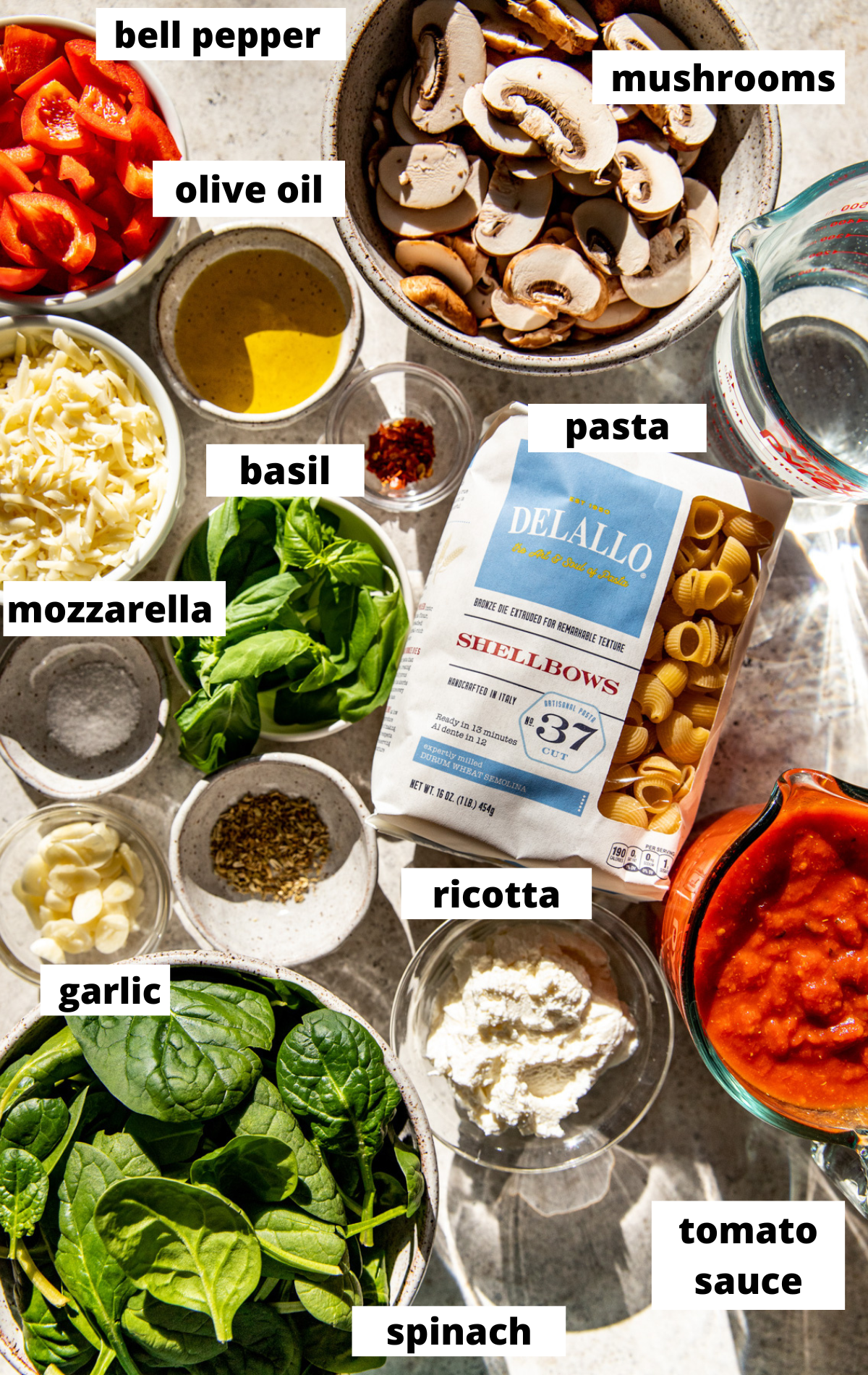 Recipe ingredients arranged on a wooden tray with labels.