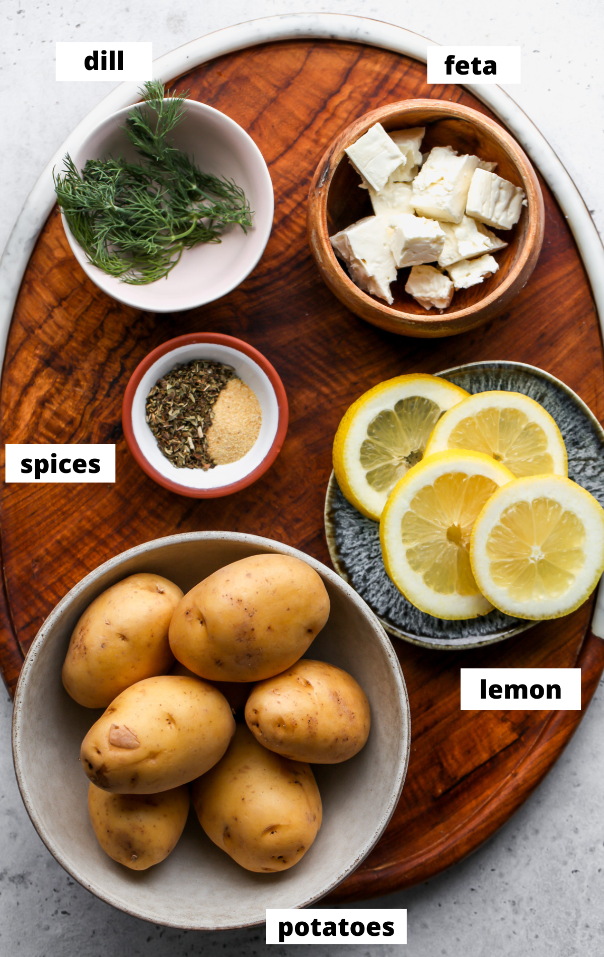 Recipe ingredients arranged on a wooden board with labels.
