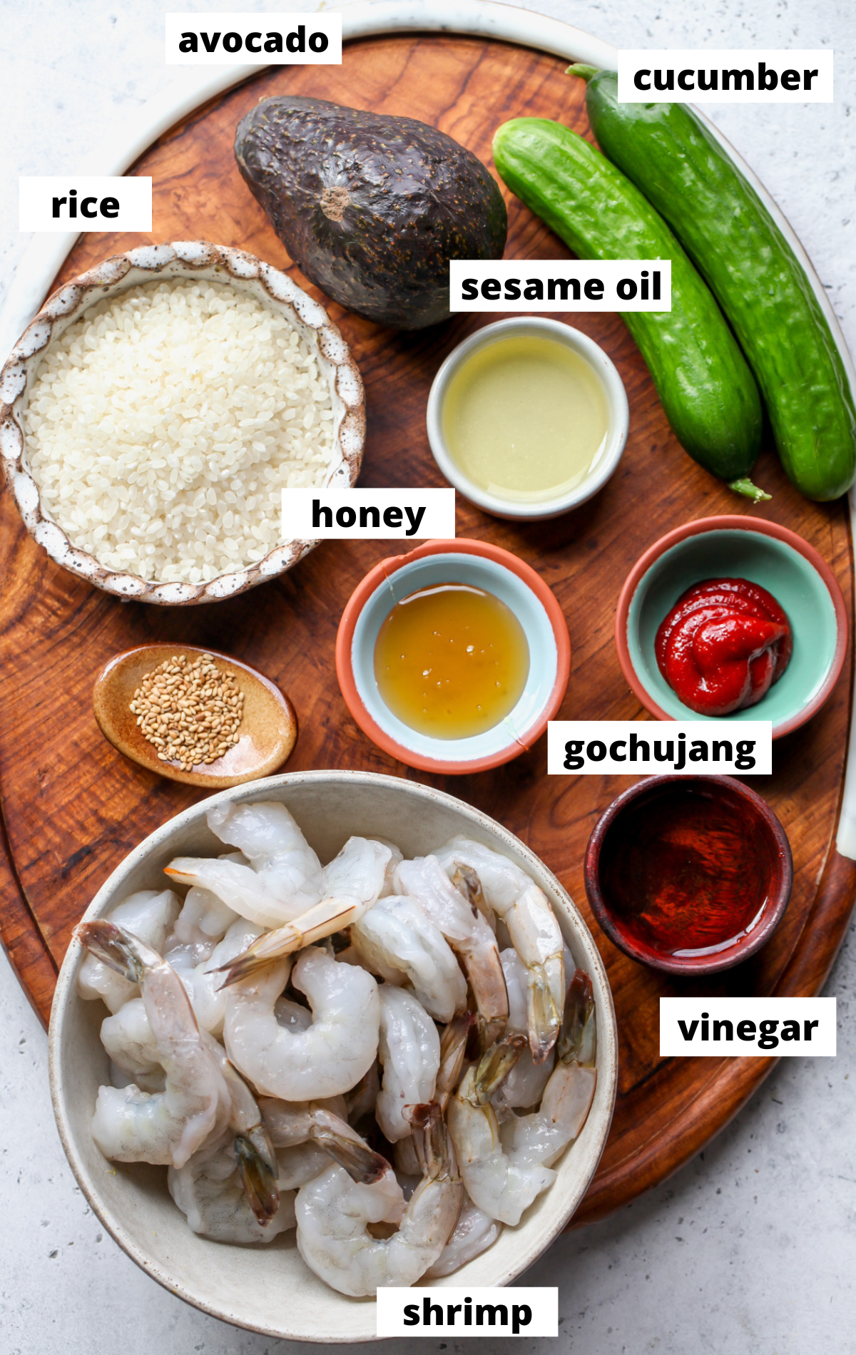 Recipe ingredients arranged on a wooden board with labels.