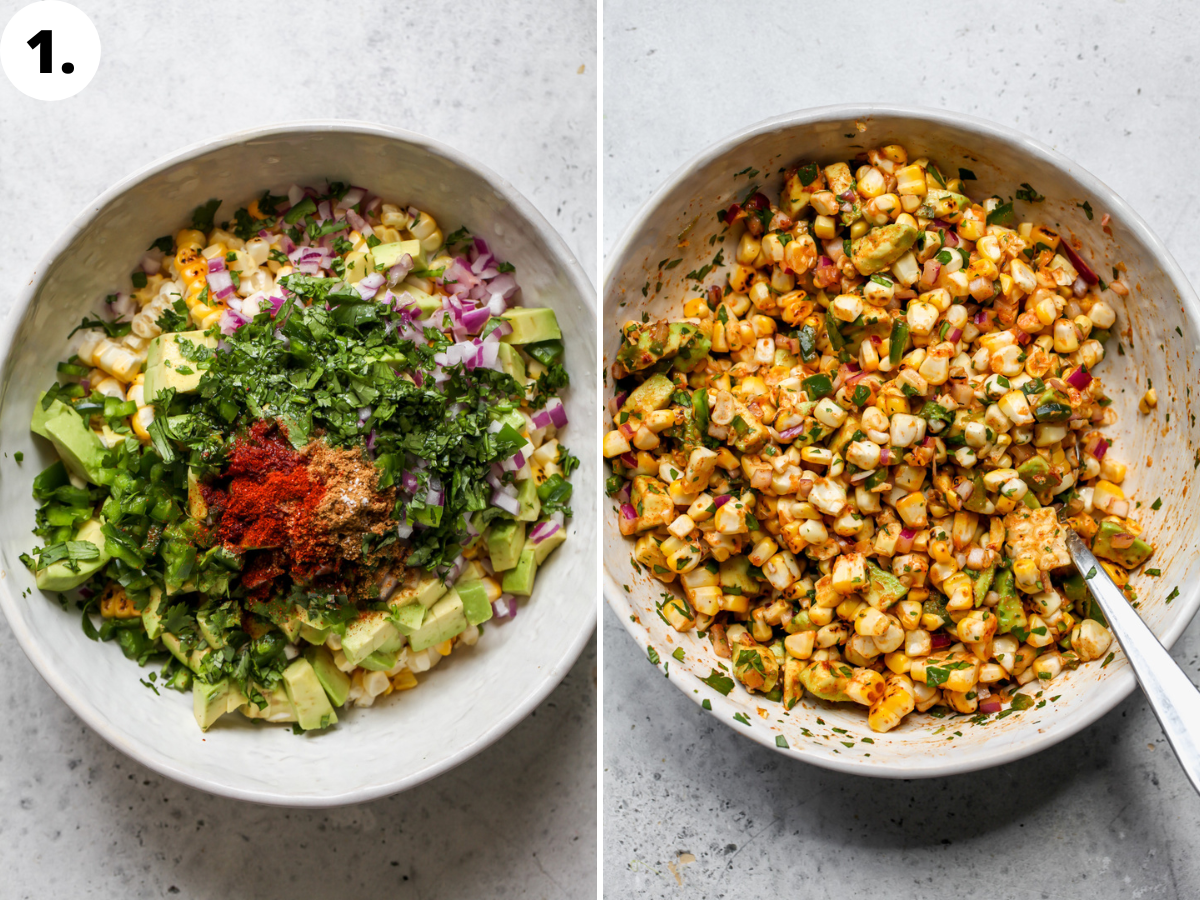 Corn, cilantro, avocado, red onion, jalapeno, lime, and spices being mixed in a large white bowl.