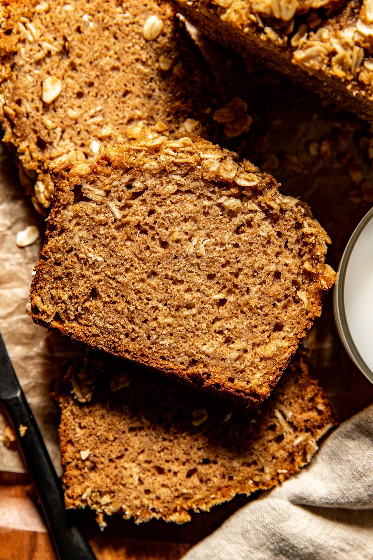 Apple Oatmeal Bread sliced on a wooden platter.