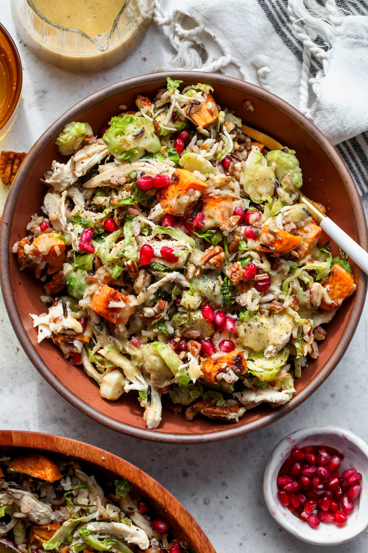 Harvest Fall Salad styled in a maroon serving bowl.