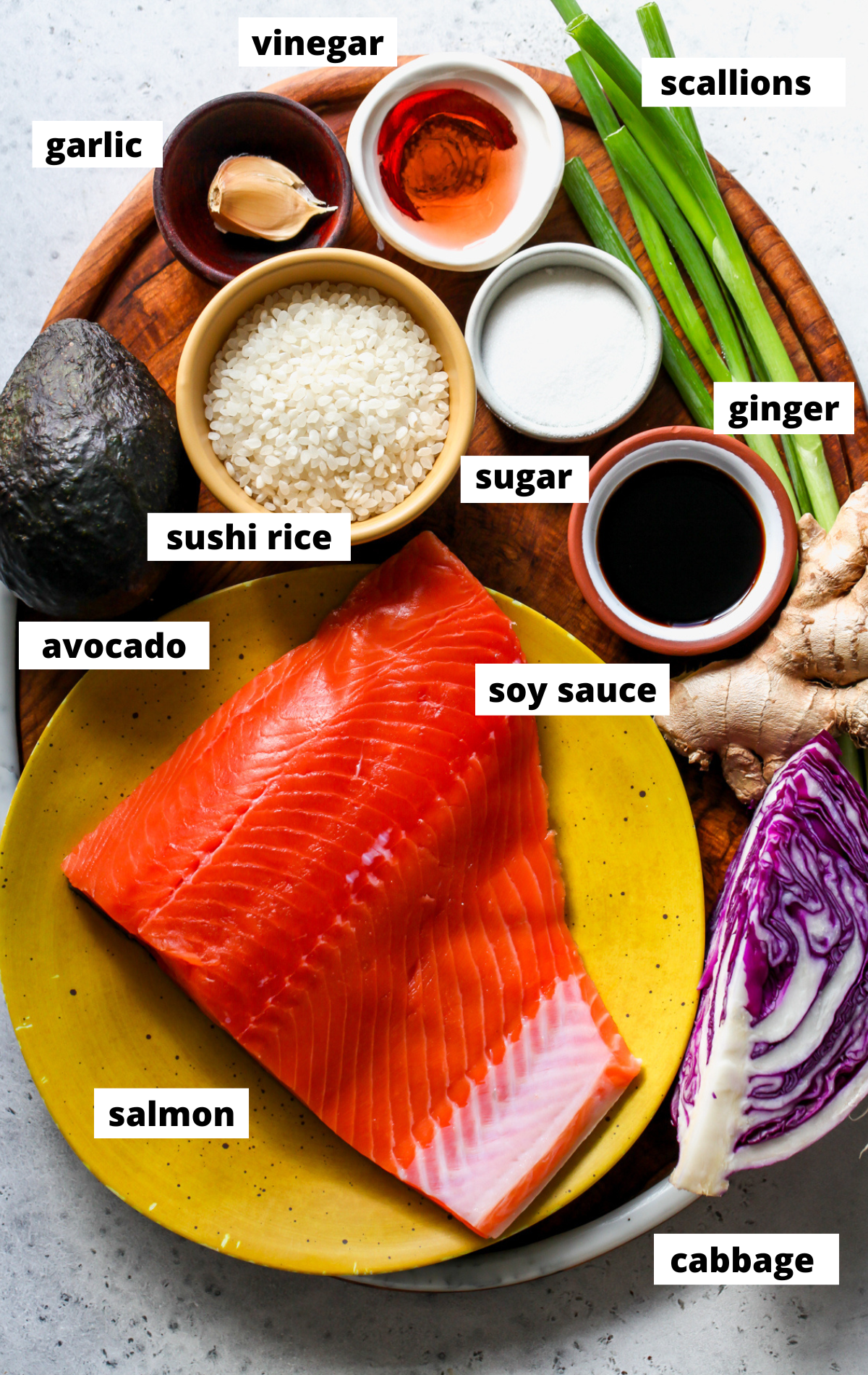 Recipe ingredients arranged in separate bowls assembled on a wooden tray.