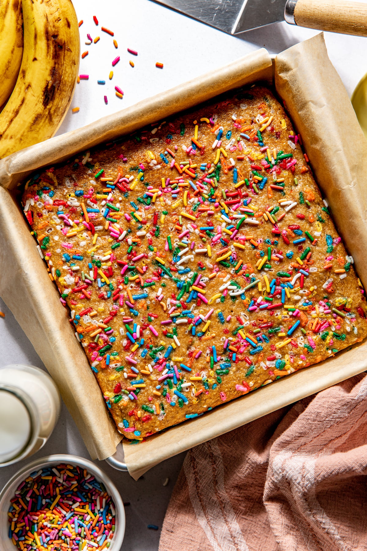 A 9x9 inch baking pan with bars after being removed from the oven.