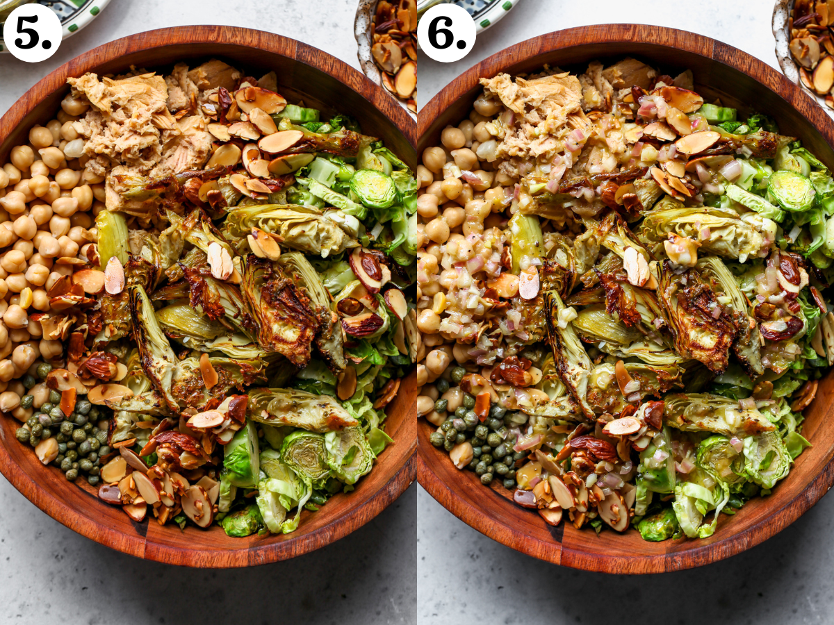 All of the salad components combined in a wooden salad bowl, and dressing being poured overtop.