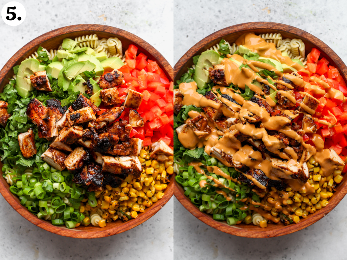 Cut pieces of chicken being added to the bowl of salad, and dressing being poured overtop.