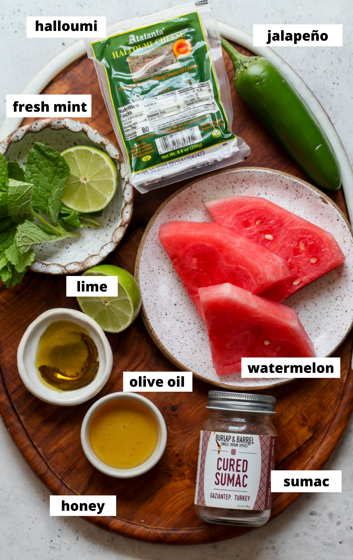 Recipe ingredients arranged on a platter with labels.